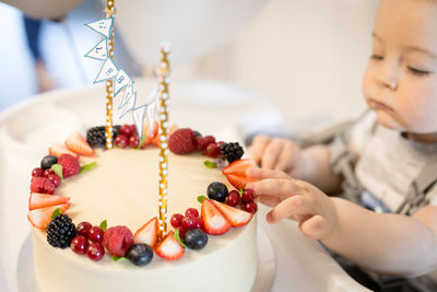 Close-up of woman holding cake