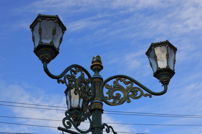 Vintage iron street lamp with blue sky on clear day