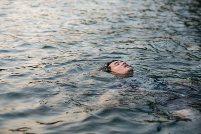 Man swimming in lake