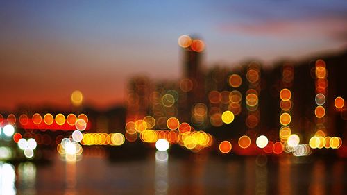 Illuminated lanterns hanging in city at night