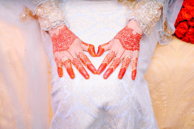 High angle view of bride with henna tattoo