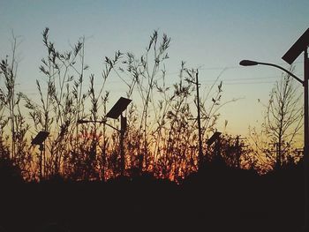 Silhouette landscape against sky at sunset