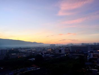 High angle view of city at sunset