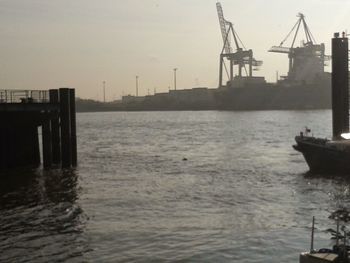 Boats moored at harbor