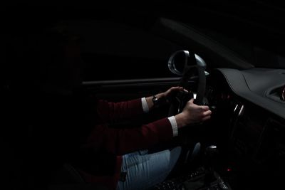 Close-up of hand in car