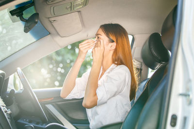 Woman sitting in car