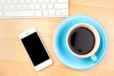 High angle view of coffee cup on table