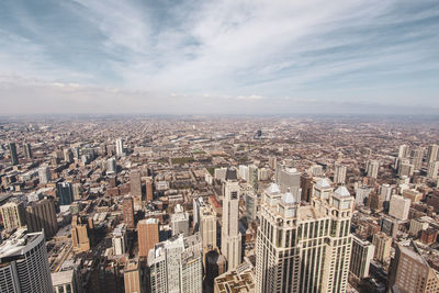 High angle view of modern buildings in city against sky