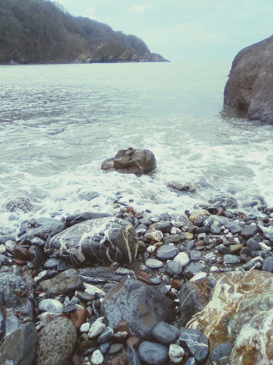 water, sea, rock - object, beauty in nature, scenics, rock formation, tranquility, rock, nature, tranquil scene, shore, beach, idyllic, sky, wave, horizon over water, vacations, surf, stone - object, outdoors