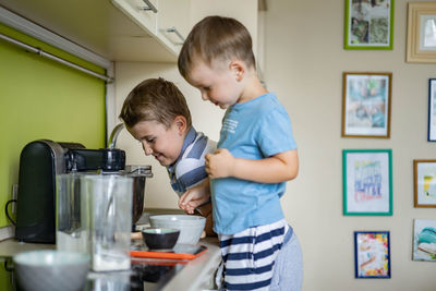 Side view of kids preparing food