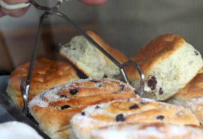 Close-up of hand holding meat