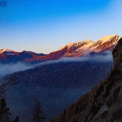 Scenic view of snowcapped mountains against clear sky