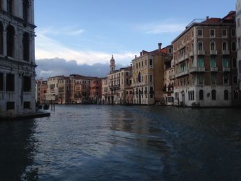 Grand canal amidst buildings against sky