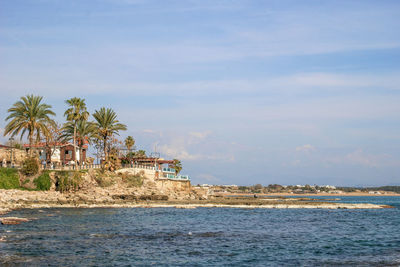 Side, turkey - february 24, 2023. port with hotels and cafes on a stony and sandy beach.