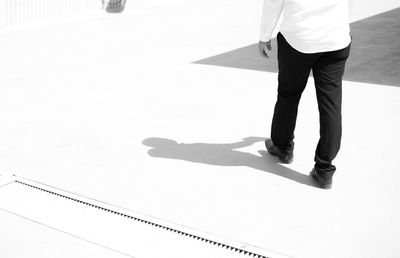 Low section of man standing on floor