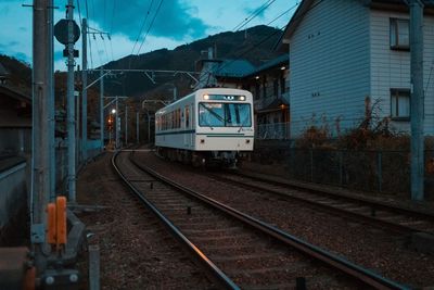 Train at railroad station against sky