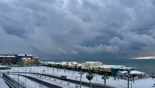 Scenic view of sea against storm clouds