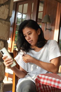 Woman using mobile phone