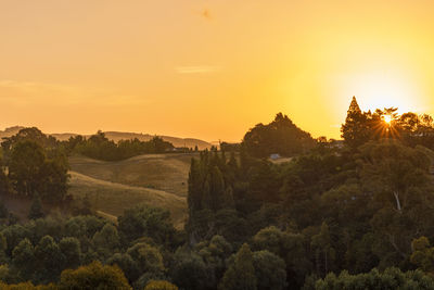 Scenic view of landscape against sky during sunset