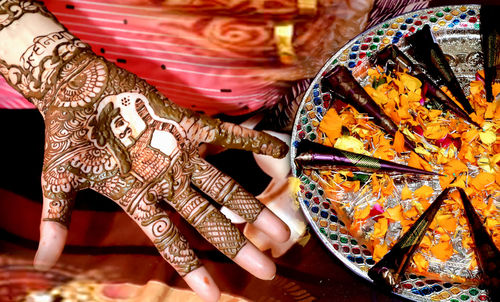 Low section of woman with henna tattoo