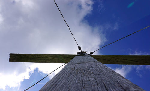 Low angle view of windmill against sky