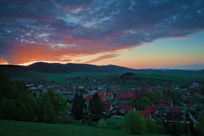 Scenic view of townscape against sky during sunset