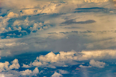 Low angle view of airplane flying in sky