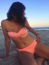 Midsection of woman at beach