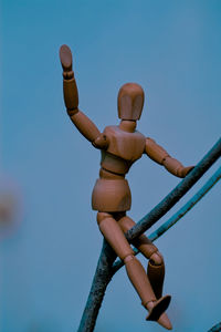 Low angle view of sculpture against blue sky