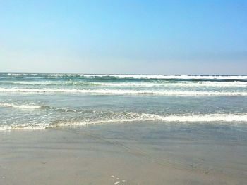 Scenic view of sea against clear sky