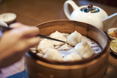 Midsection of person preparing food on table