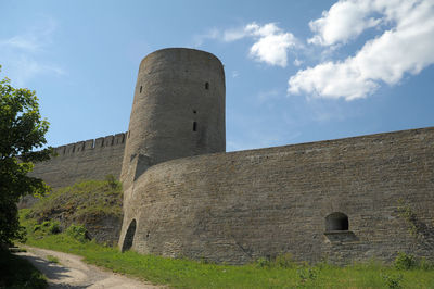 Low angle view of old ruin building against sky