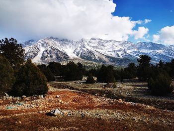 Scenic view of snowcapped mountains against sky