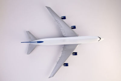 Close-up of model airplane over white background