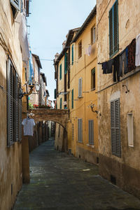 Narrow alley amidst buildings in town