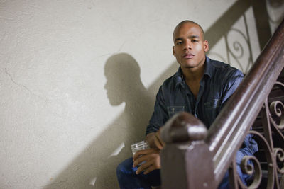 Portrait of a young man on a staircase