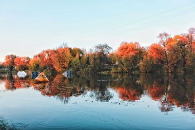 Reflection of trees in lake against sky during autumn