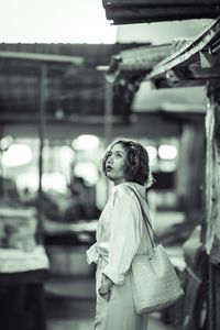 Portrait of a young woman standing outdoors