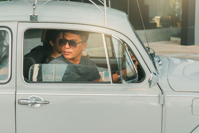 Portrait of woman sitting in car