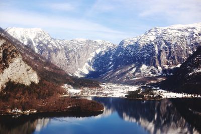 Scenic view of snowcapped mountains against sky during winter