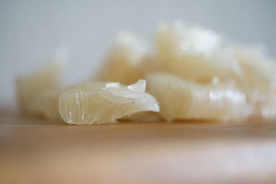 Close-up of cake on table against white background