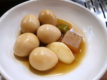 High angle view of eggs in plate on table