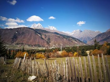 Scenic view of landscape and mountains against sky