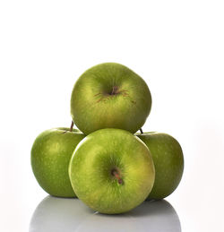 Close-up of apples on apple against white background
