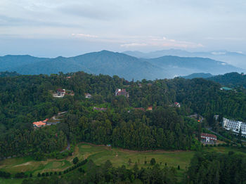 Scenic view of landscape and mountains against sky