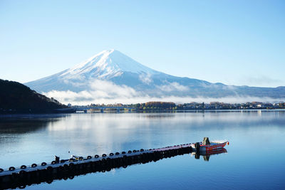 Scenic view of mountains against clear blue sky