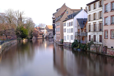 River in city against clear sky