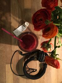 High angle view of roses in vase on table