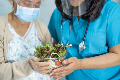 Midsection of woman working with food