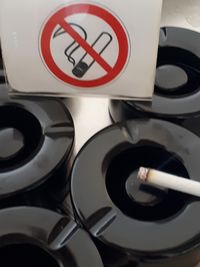 High angle view of cigarette smoking sign